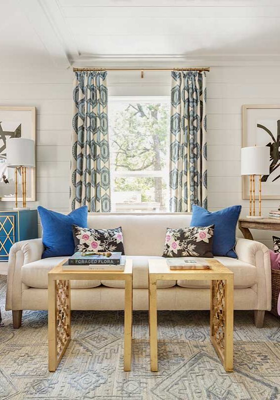 Living room with purple and navy accents and custom artwork